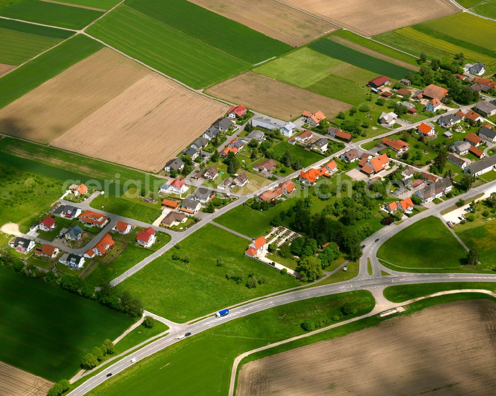 Grüningen from above - Agricultural land and field boundaries surround the settlement area of the village in Grüningen in the state Baden-Wuerttemberg, Germany