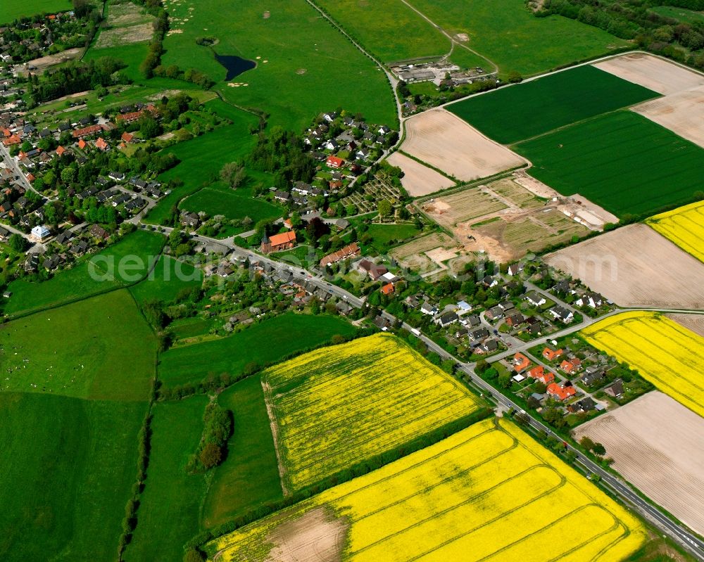 Groß Grönau from above - Agricultural land and field boundaries surround the settlement area of the village in Groß Grönau in the state Schleswig-Holstein, Germany