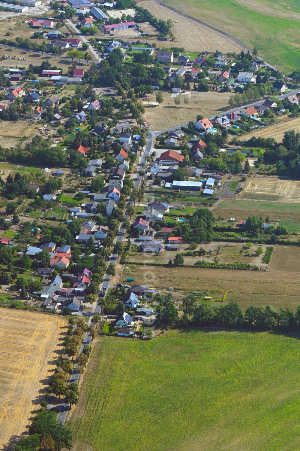 Aerial image Groß Kreutz - Agricultural land and field boundaries surround the settlement area of the village in Groß Kreutz in the state Brandenburg, Germany