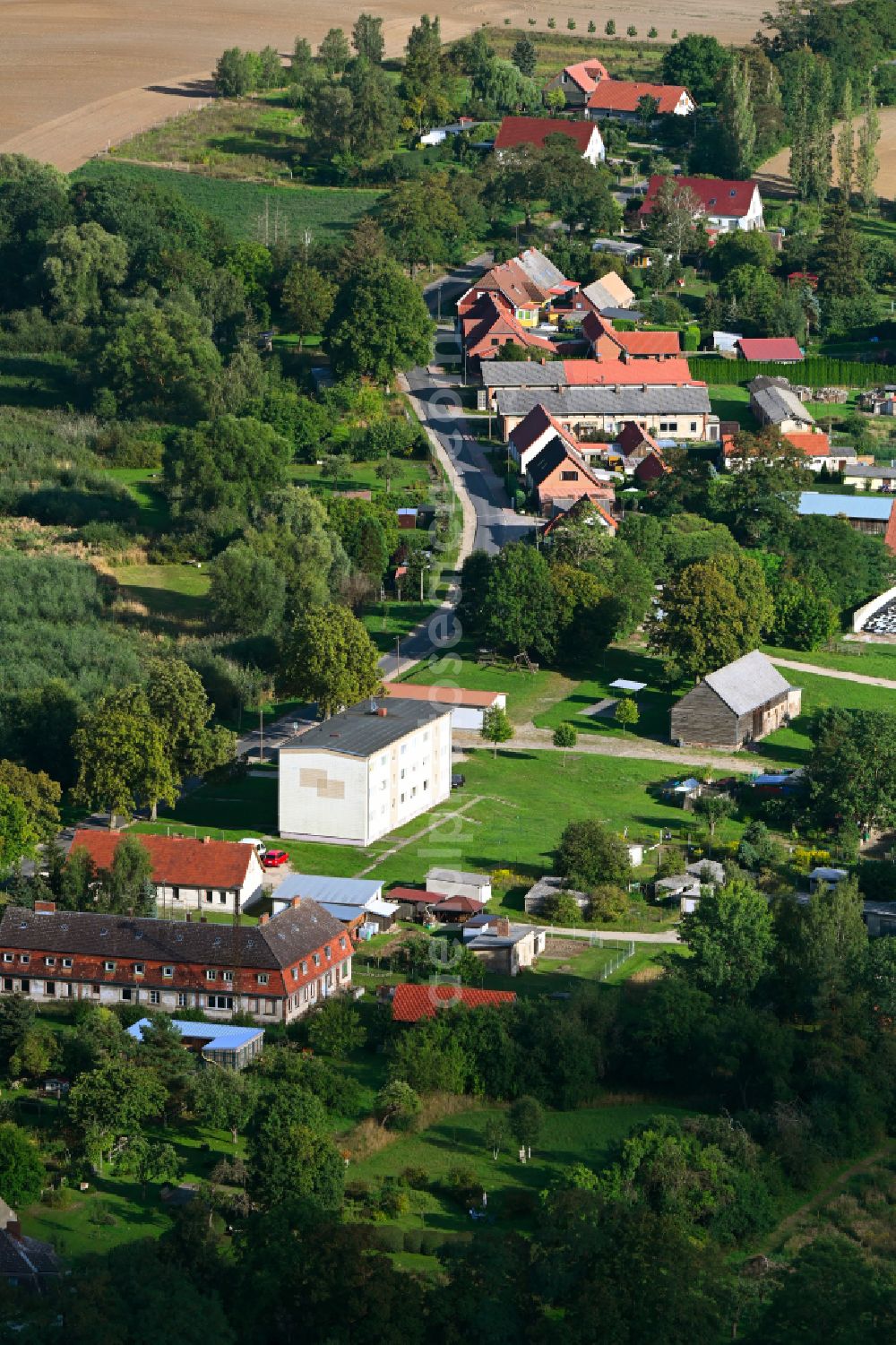 Groß Sperrenwalde from the bird's eye view: Agricultural land and field boundaries surround the settlement area of the village in Gross Sperrenwalde in the state Brandenburg, Germany