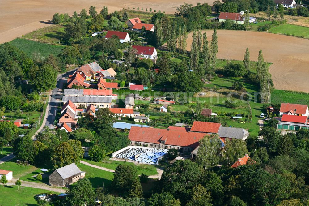 Aerial image Groß Sperrenwalde - Agricultural land and field boundaries surround the settlement area of the village in Gross Sperrenwalde in the state Brandenburg, Germany