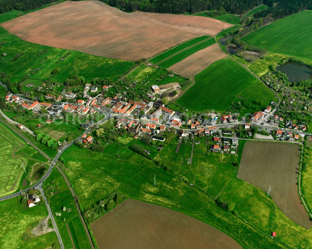 Großebersdorf from above - Agricultural land and field boundaries surround the settlement area of the village in Großebersdorf in the state Thuringia, Germany