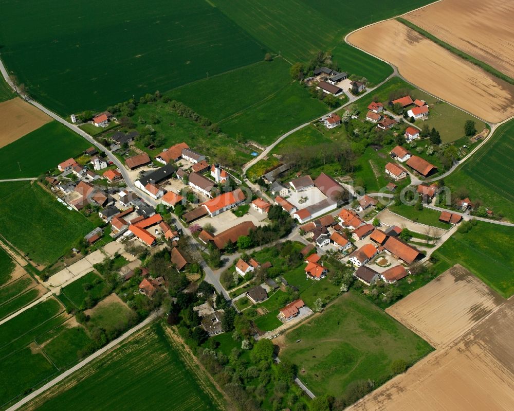 Großenpinning from above - Agricultural land and field boundaries surround the settlement area of the village in Großenpinning in the state Bavaria, Germany