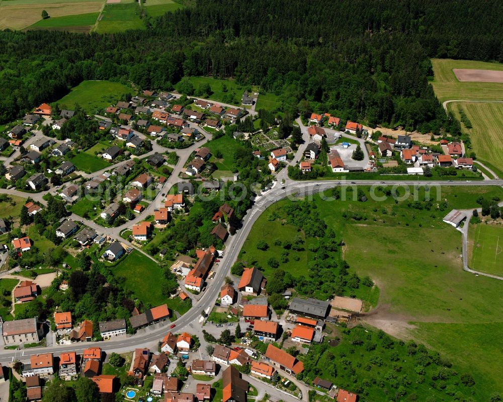 Großerlach from above - Agricultural land and field boundaries surround the settlement area of the village in Großerlach in the state Baden-Wuerttemberg, Germany