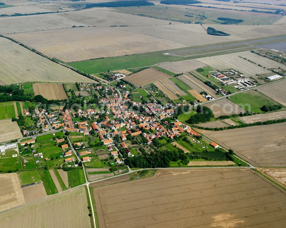 Aerial image Großmehlra - Agricultural land and field boundaries surround the settlement area of the village in Großmehlra in the state Thuringia, Germany