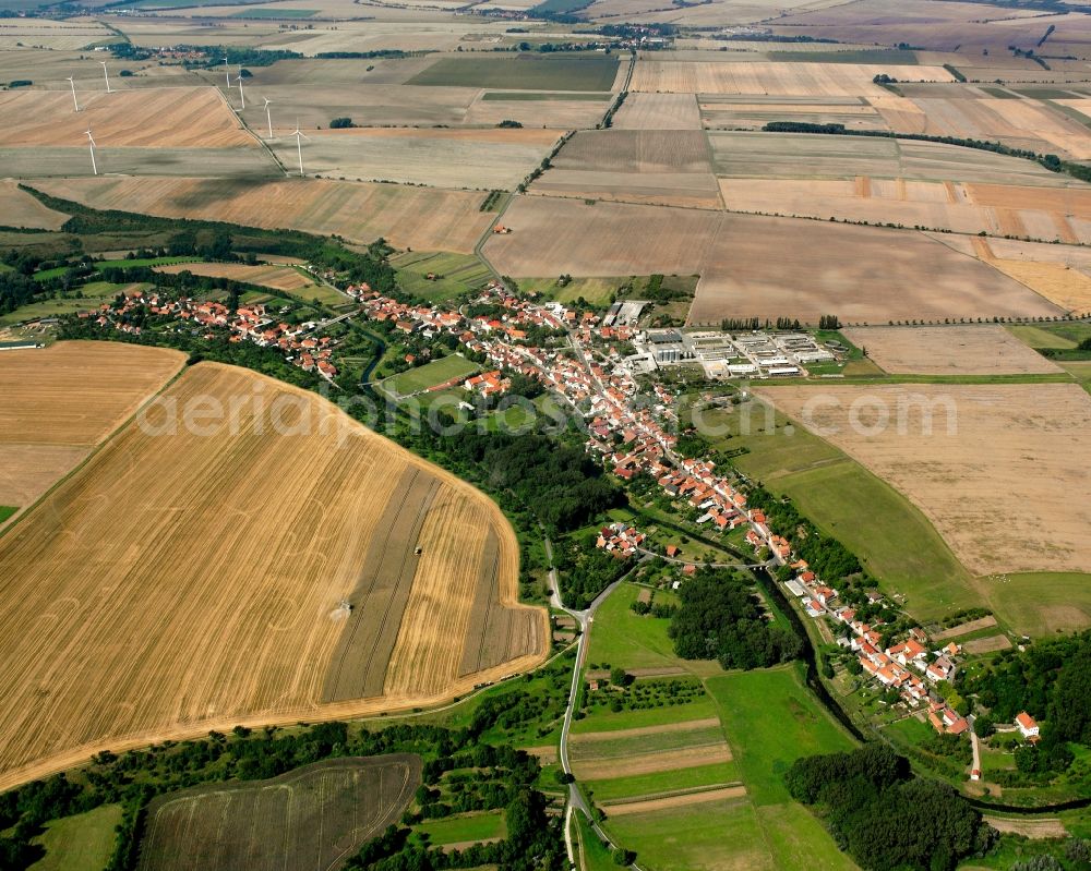 Großvargula from above - Agricultural land and field boundaries surround the settlement area of the village in Großvargula in the state Thuringia, Germany