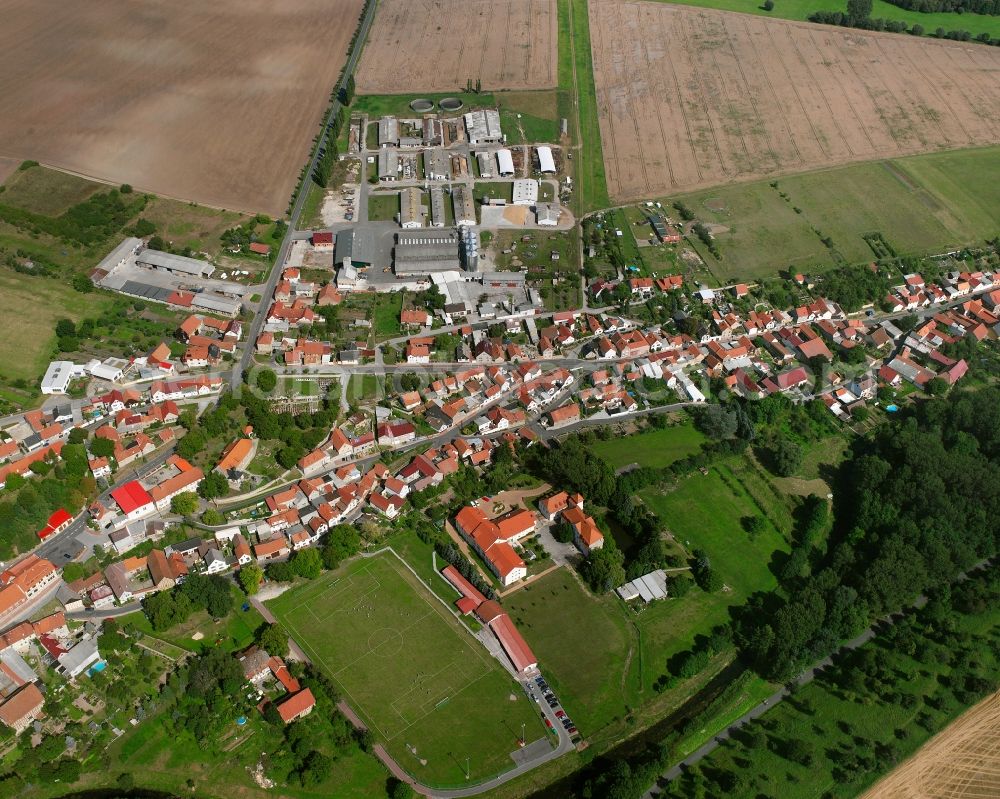 Aerial image Großvargula - Agricultural land and field boundaries surround the settlement area of the village in Großvargula in the state Thuringia, Germany