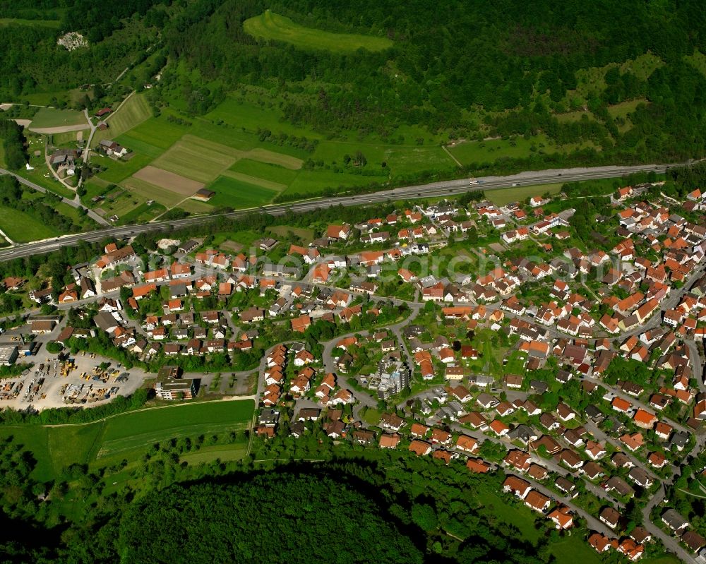 Gruibingen from above - Agricultural land and field boundaries surround the settlement area of the village in Gruibingen in the state Baden-Wuerttemberg, Germany