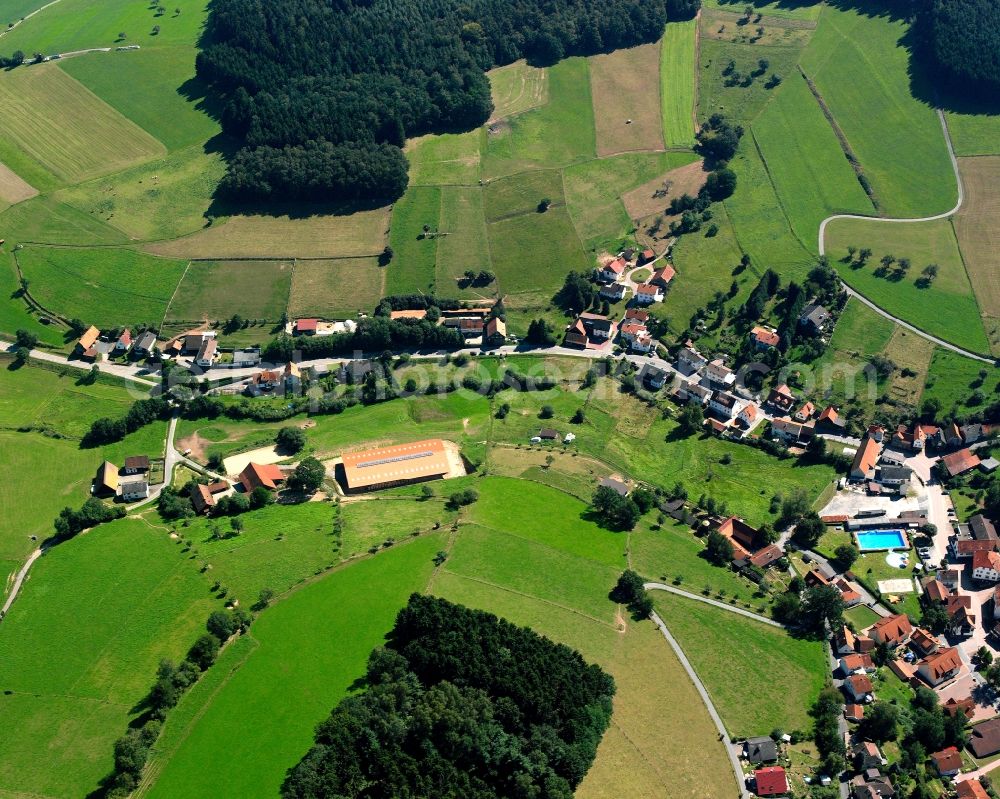 Aerial photograph Güttersbach - Agricultural land and field boundaries surround the settlement area of the village in Güttersbach in the state Hesse, Germany