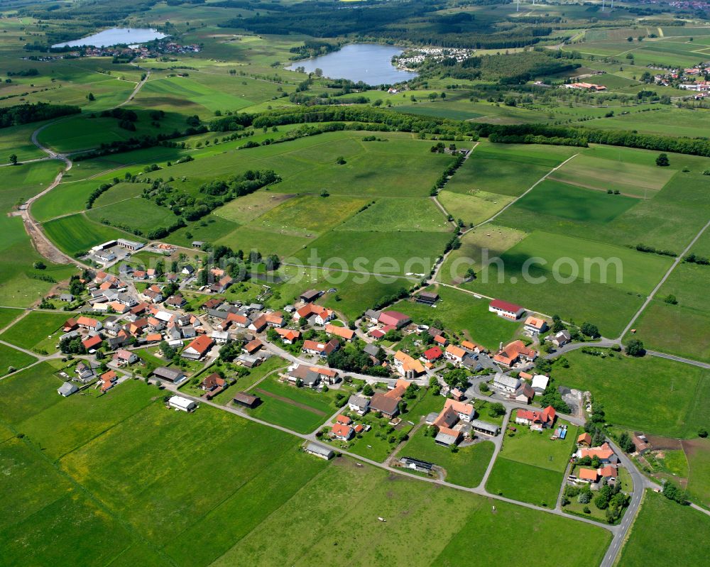 Gunzenau from the bird's eye view: Agricultural land and field boundaries surround the settlement area of the village in Gunzenau in the state Hesse, Germany