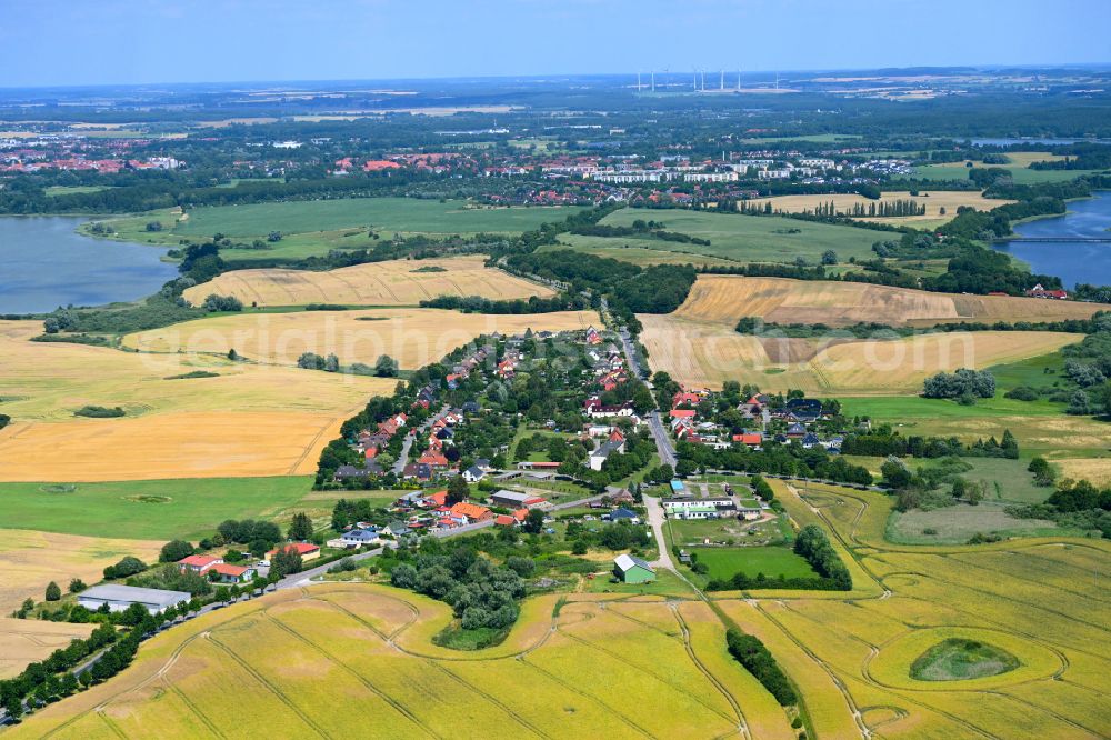 Gutow from above - Agricultural land and field boundaries surround the settlement area of the village in Gutow in the state Mecklenburg - Western Pomerania, Germany