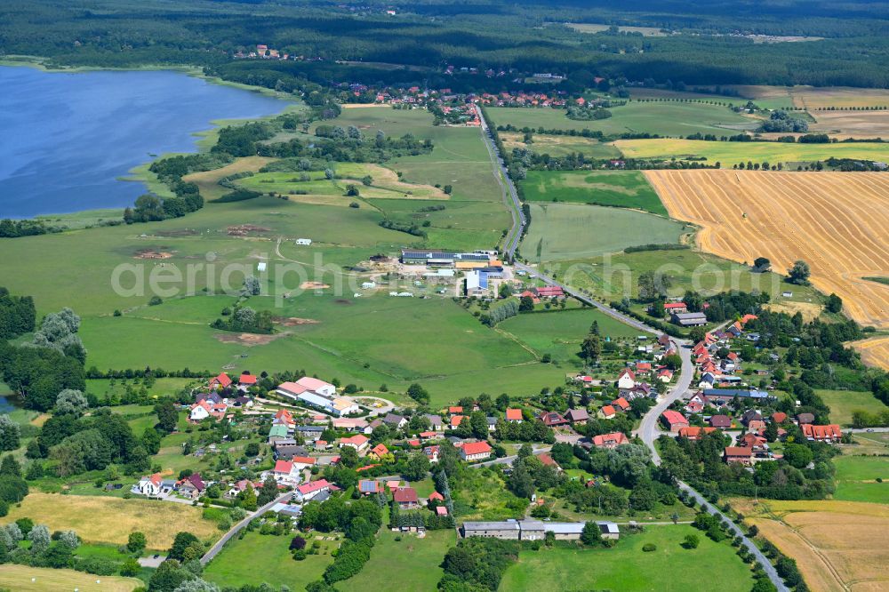 Gutow from the bird's eye view: Agricultural land and field boundaries surround the settlement area of the village in Gutow in the state Mecklenburg - Western Pomerania, Germany