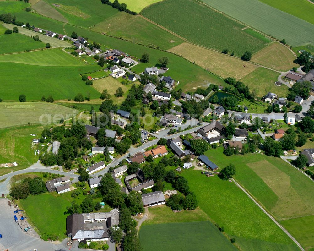 Aerial image Hadermannsgrün - Agricultural land and field boundaries surround the settlement area of the village in Hadermannsgrün in the state Bavaria, Germany