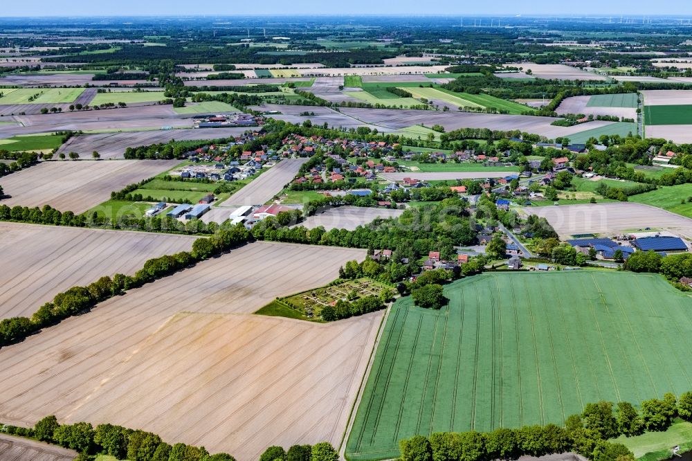 Aerial image Hagenah - Agricultural land and field boundaries surround the settlement area of the village in Hagenah in the state Lower Saxony, Germany