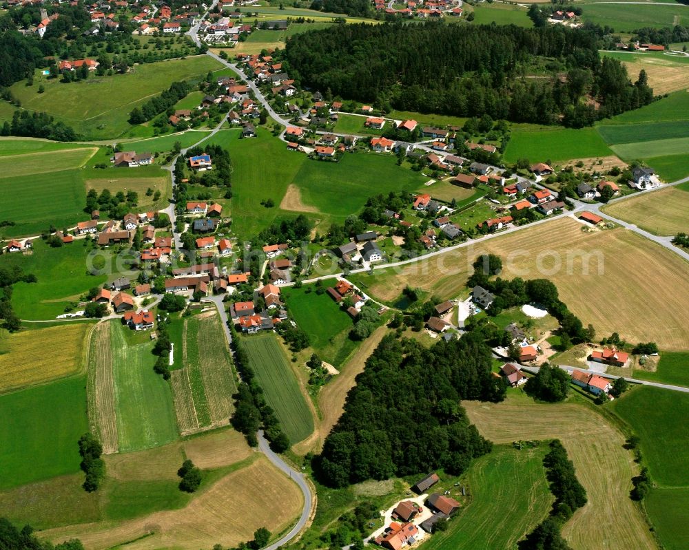 Aerial photograph Hagnzell - Agricultural land and field boundaries surround the settlement area of the village in Hagnzell in the state Bavaria, Germany