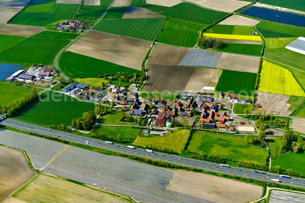 Haidt from the bird's eye view: Agricultural land and field boundaries surround the settlement area of the village in Haidt in the state Bavaria, Germany