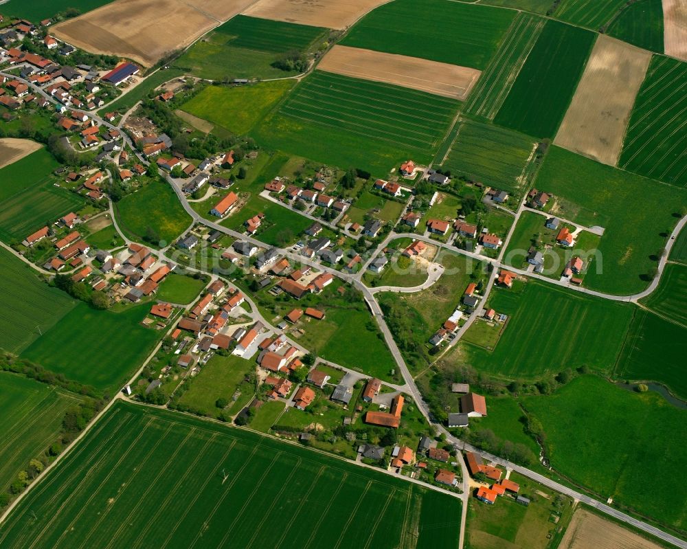 Haimelkofen from above - Agricultural land and field boundaries surround the settlement area of the village in Haimelkofen in the state Bavaria, Germany