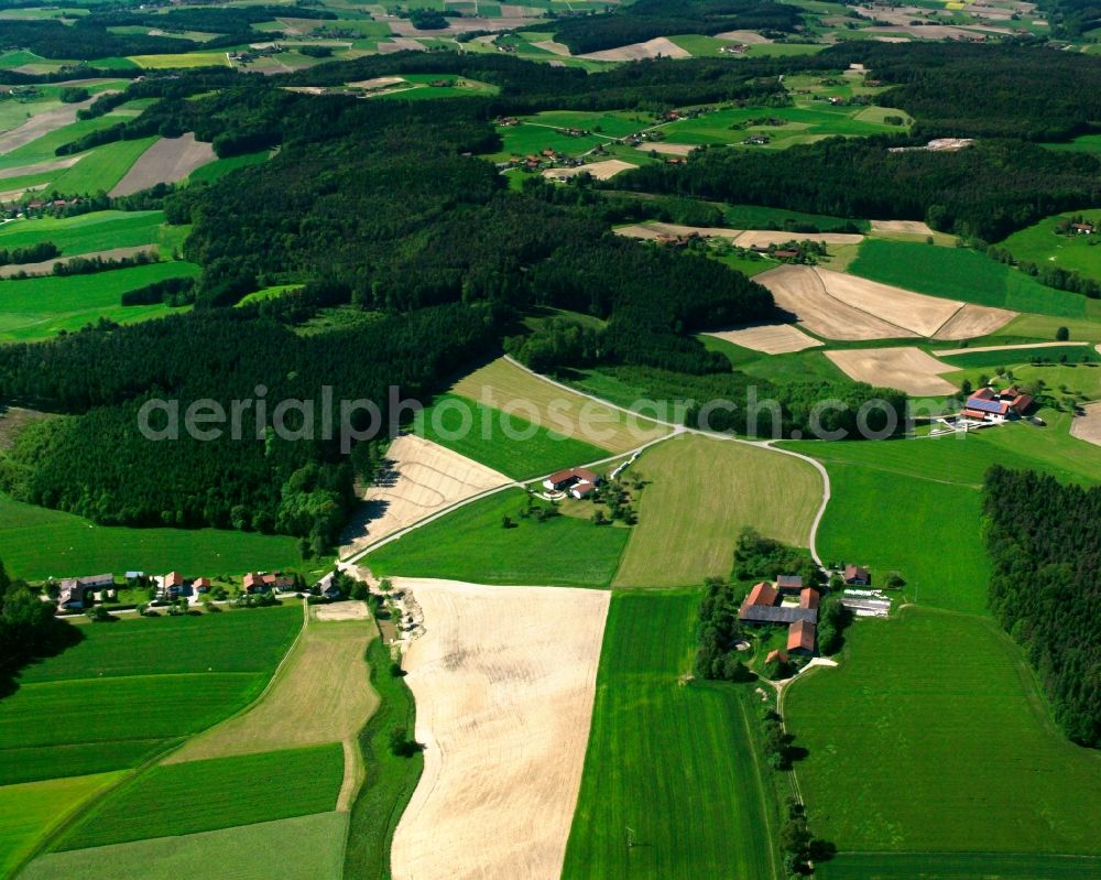 Aerial image Hainthal - Agricultural land and field boundaries surround the settlement area of the village in Hainthal in the state Bavaria, Germany