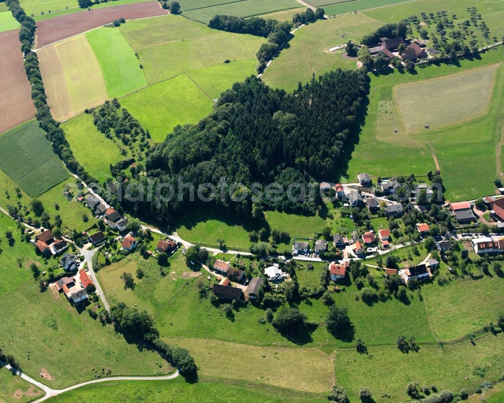 Haisterbach from above - Agricultural land and field boundaries surround the settlement area of the village in Haisterbach in the state Hesse, Germany