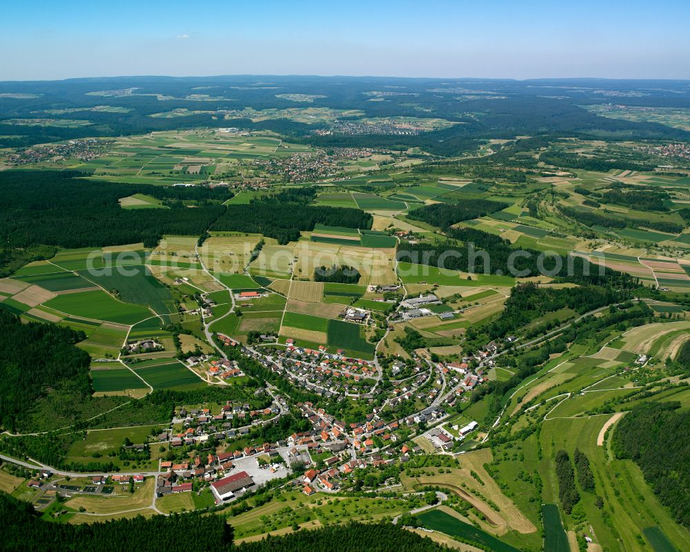 Haiterbach from above - Agricultural land and field boundaries surround the settlement area of the village in Haiterbach in the state Baden-Wuerttemberg, Germany