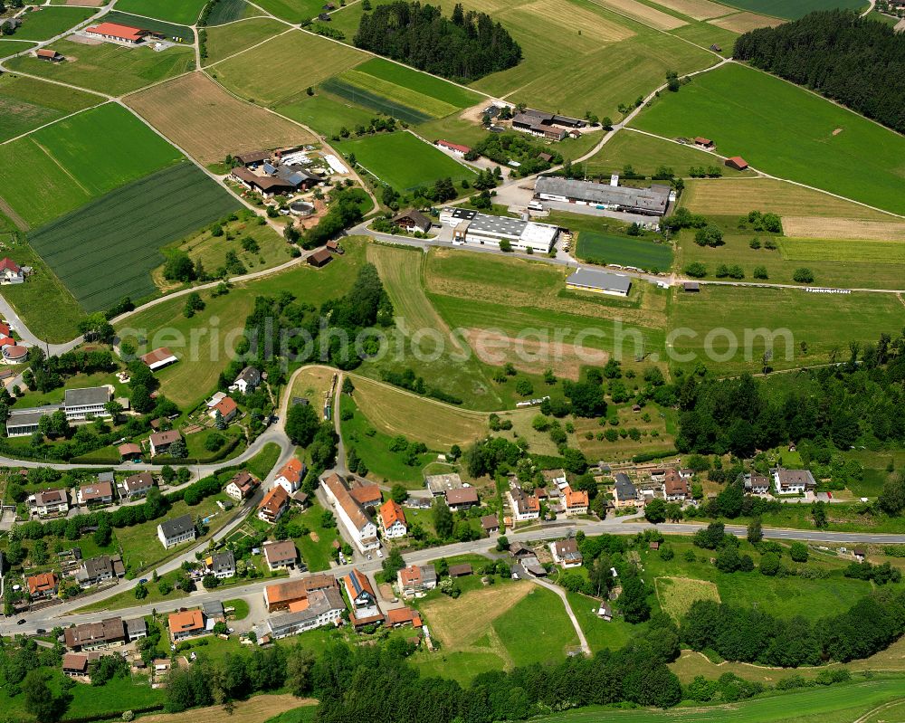 Haiterbach from the bird's eye view: Agricultural land and field boundaries surround the settlement area of the village in Haiterbach in the state Baden-Wuerttemberg, Germany