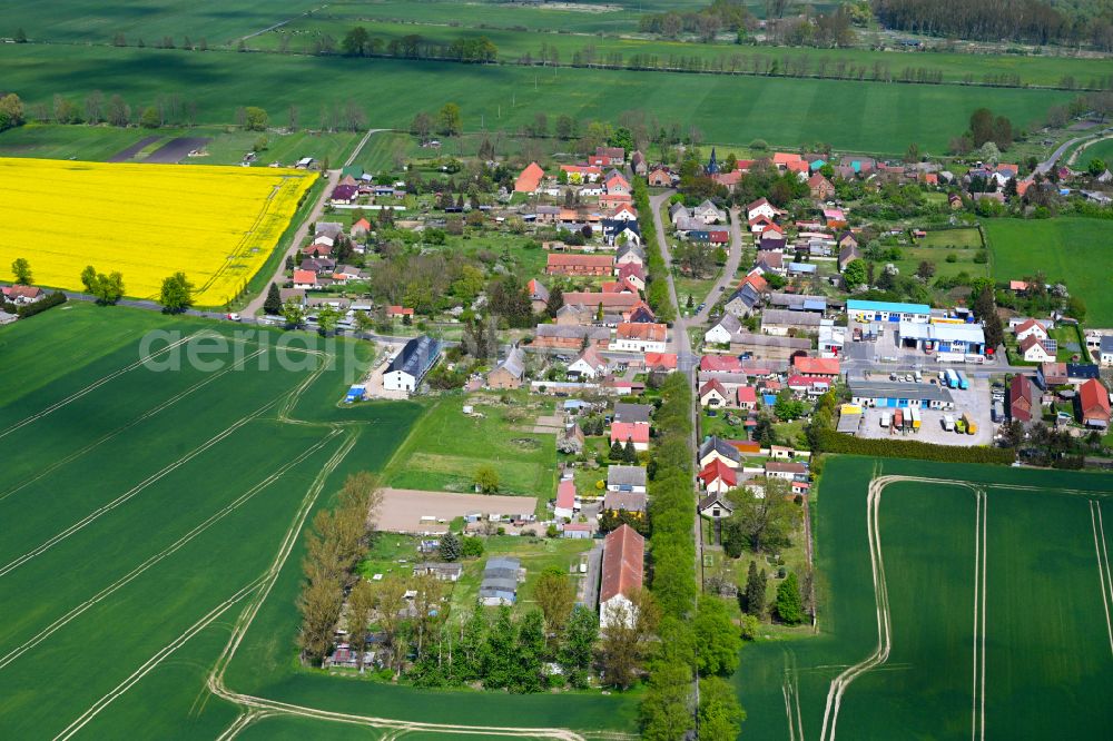 Aerial image Hakenberg - Agricultural land and field boundaries surround the settlement area of the village in Hakenberg in the state Brandenburg, Germany