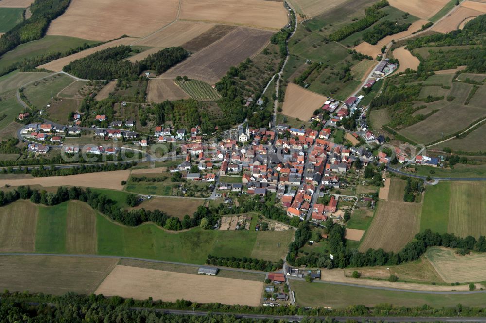 Halsheim from the bird's eye view: Agricultural land and field boundaries surround the settlement area of the village in Halsheim in the state Bavaria, Germany