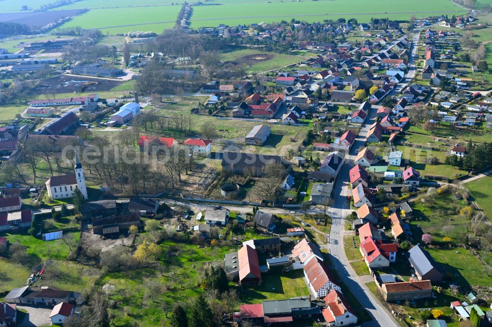 Hammer from above - Agricultural land and field boundaries surround the settlement area of the village in Hammer in the state Brandenburg, Germany