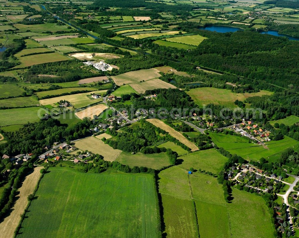 Hammer from the bird's eye view: Agricultural land and field boundaries surround the settlement area of the village in Hammer in the state Schleswig-Holstein, Germany