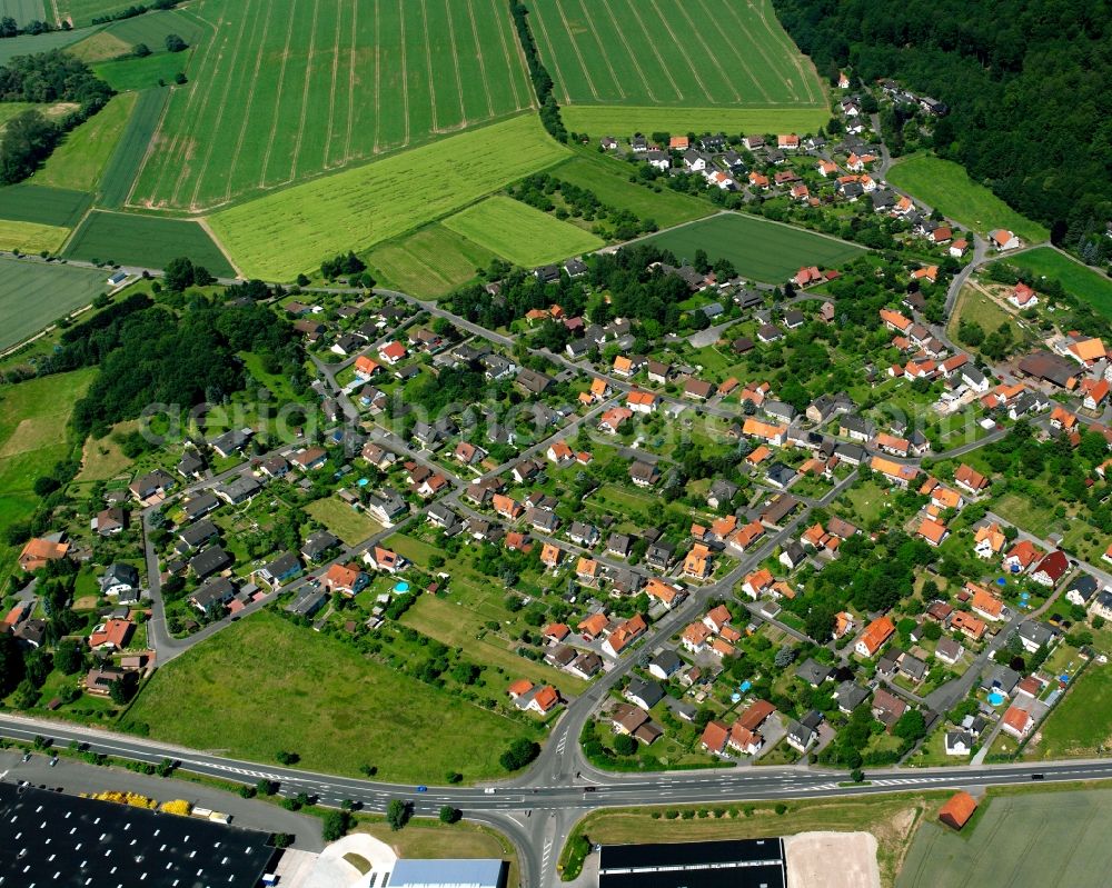 Aerial photograph Hann. Münden - Agricultural land and field boundaries surround the settlement area of the village in Hann. Muenden in the state Lower Saxony, Germany