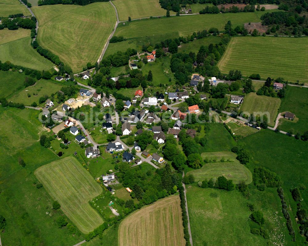 Aerial photograph Hardenberg - Agricultural land and field boundaries surround the settlement area of the village in Hardenberg in the state North Rhine-Westphalia, Germany