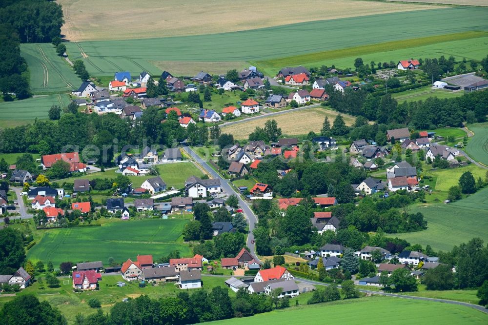 Harkemissen from above - Agricultural land and field boundaries surround the settlement area of the village in Harkemissen in the state North Rhine-Westphalia, Germany