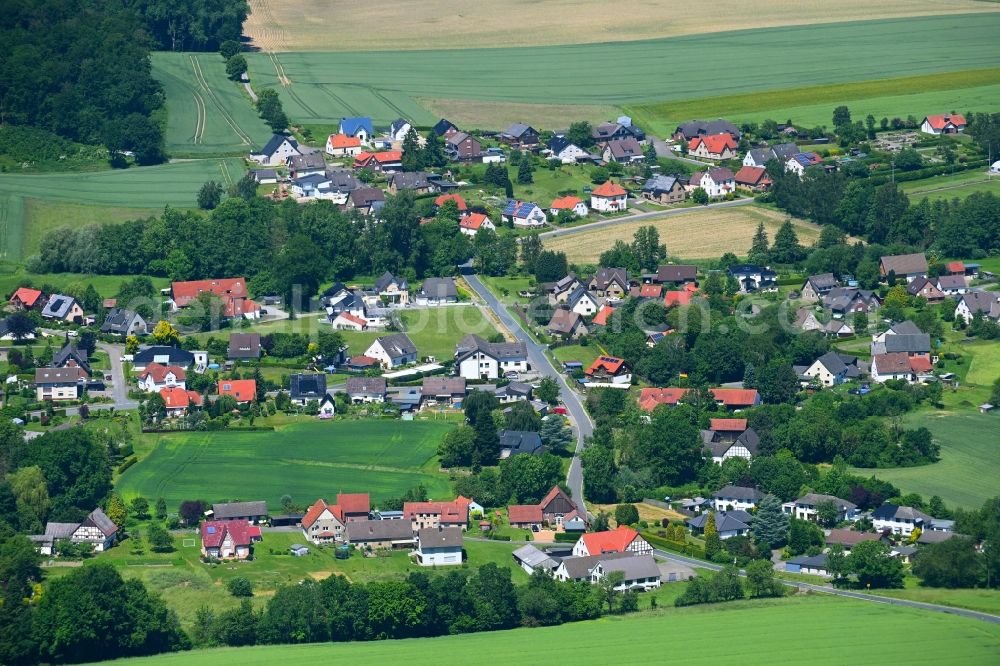 Harkemissen from the bird's eye view: Agricultural land and field boundaries surround the settlement area of the village in Harkemissen in the state North Rhine-Westphalia, Germany