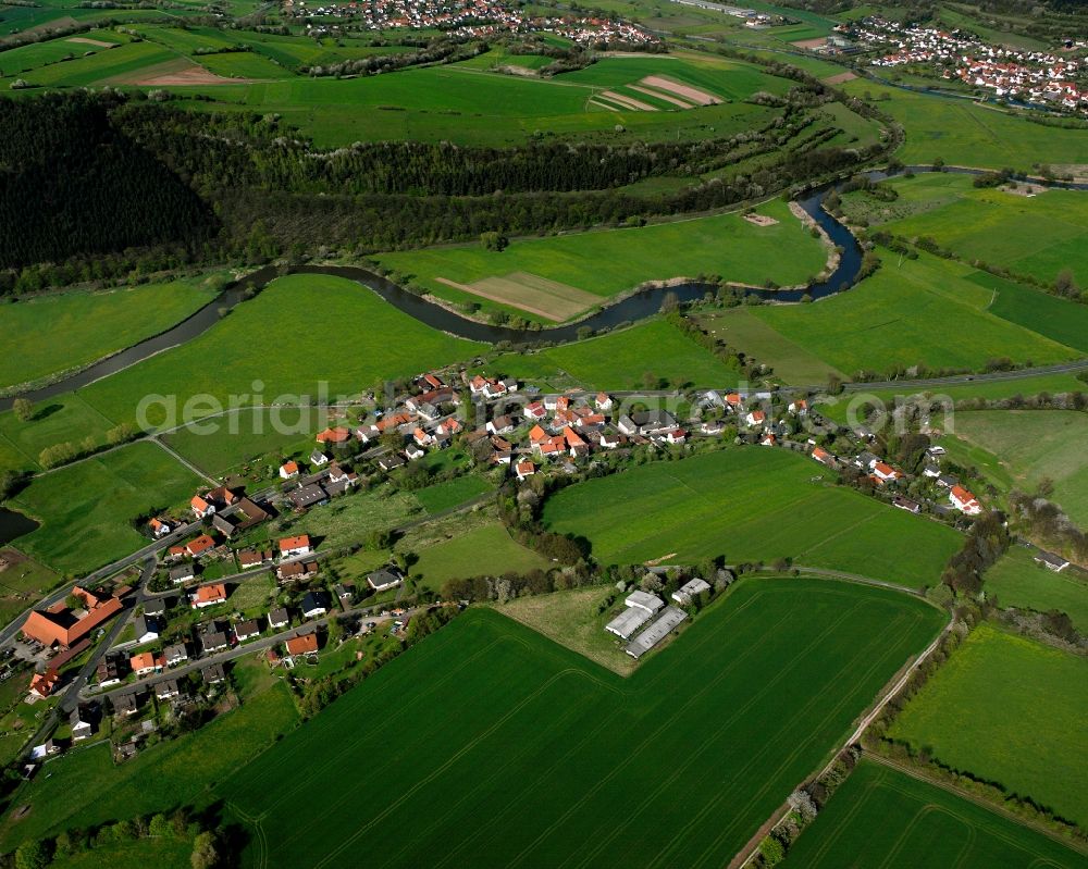 Aerial photograph Harnrode - Agricultural land and field boundaries surround the settlement area of the village in Harnrode in the state Hesse, Germany