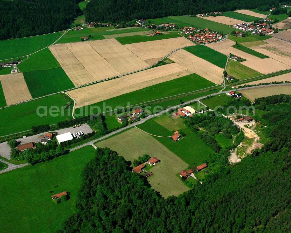 Hart from the bird's eye view: Agricultural land and field boundaries surround the settlement area of the village in Hart in the state Bavaria, Germany