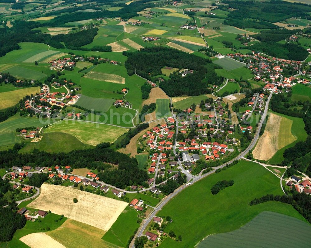 Haselbach from the bird's eye view: Agricultural land and field boundaries surround the settlement area of the village in Haselbach in the state Bavaria, Germany