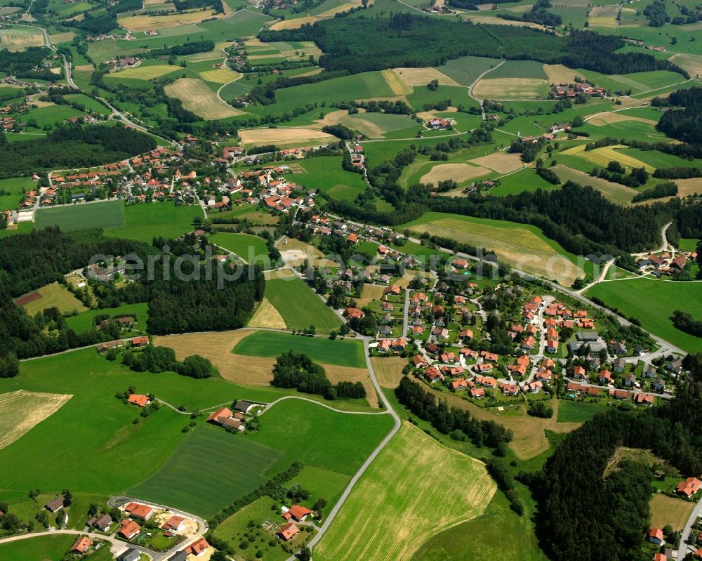 Aerial photograph Haselbach - Agricultural land and field boundaries surround the settlement area of the village in Haselbach in the state Bavaria, Germany