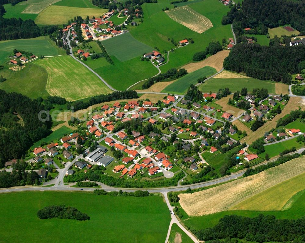 Haselbach from above - Agricultural land and field boundaries surround the settlement area of the village in Haselbach in the state Bavaria, Germany