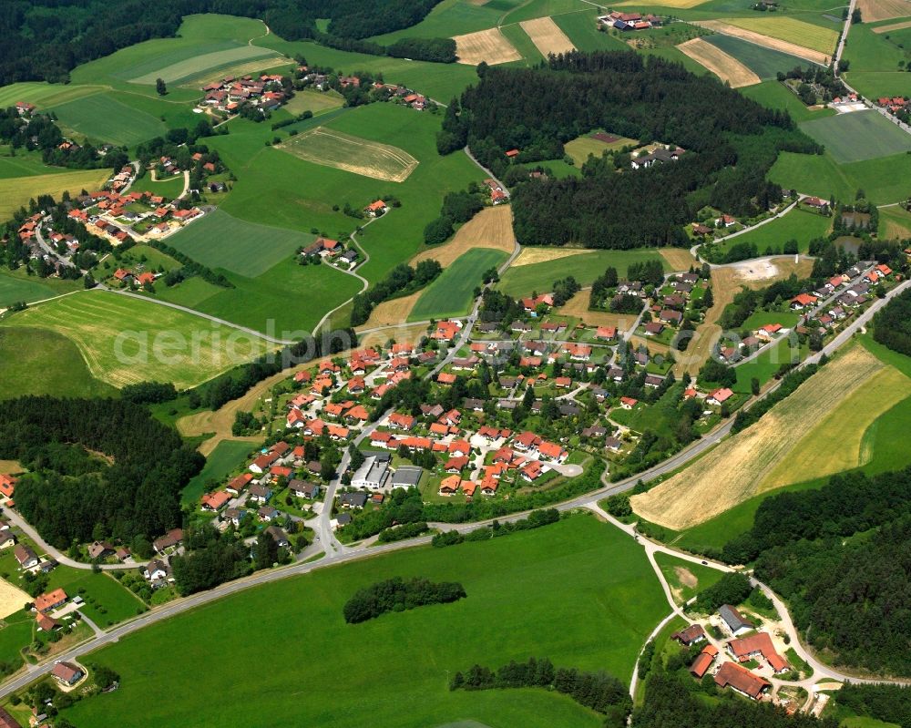 Aerial photograph Haselbach - Agricultural land and field boundaries surround the settlement area of the village in Haselbach in the state Bavaria, Germany