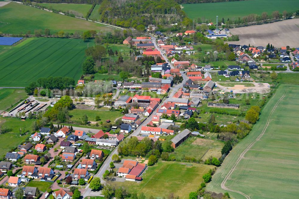 Aerial image Hassel - Agricultural land and field boundaries surround the settlement area of the village in Hassel in the state Saxony-Anhalt, Germany