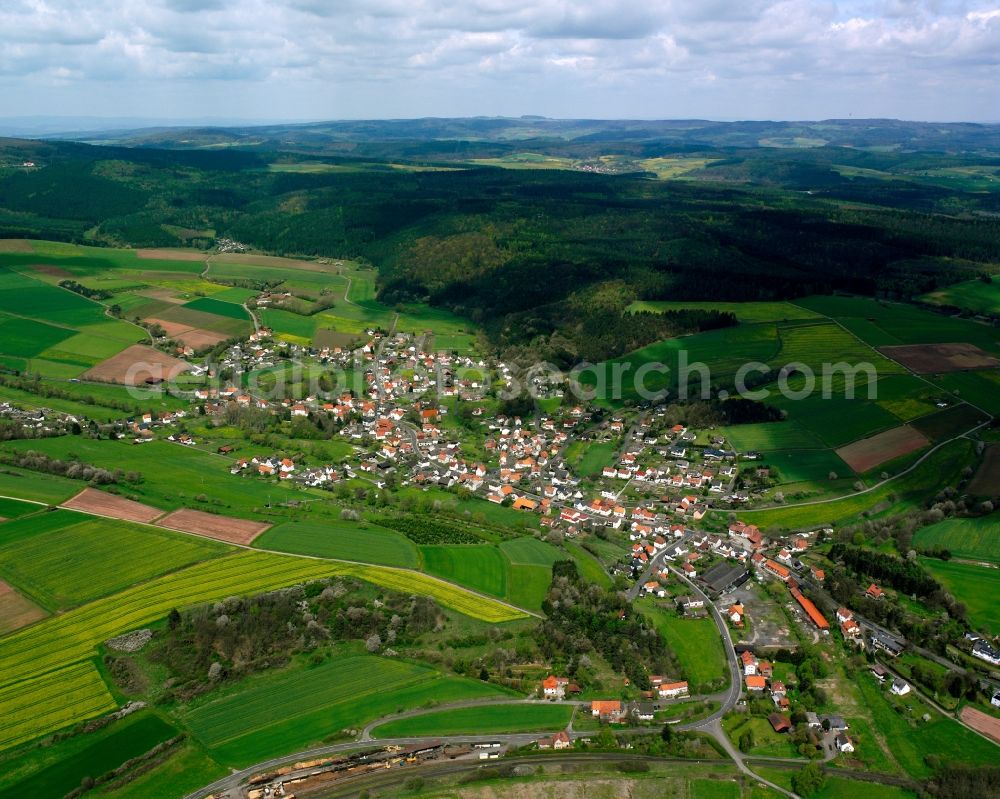 Aerial image Hatterode - Agricultural land and field boundaries surround the settlement area of the village in Hatterode in the state Hesse, Germany