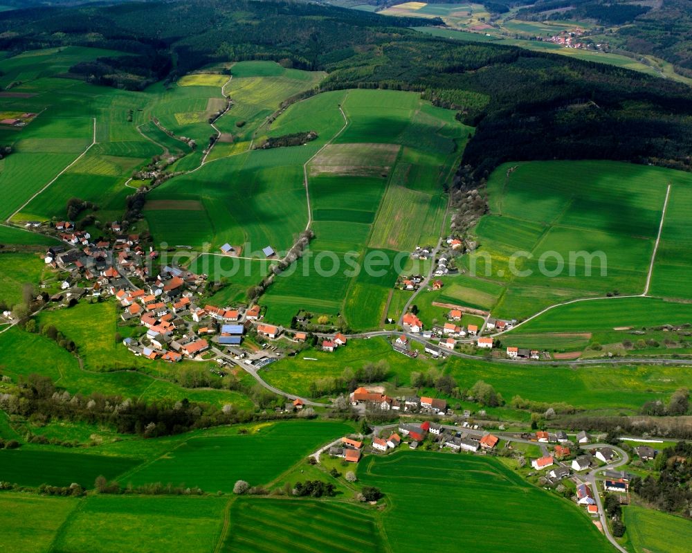 Aerial image Hatterode - Agricultural land and field boundaries surround the settlement area of the village in Hatterode in the state Hesse, Germany