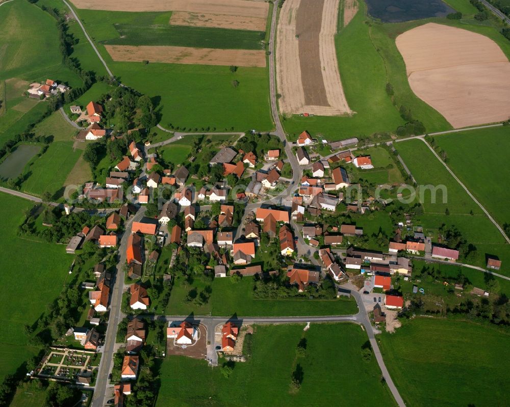 Aerial photograph Haundorf - Agricultural land and field boundaries surround the settlement area of the village in Haundorf in the state Bavaria, Germany