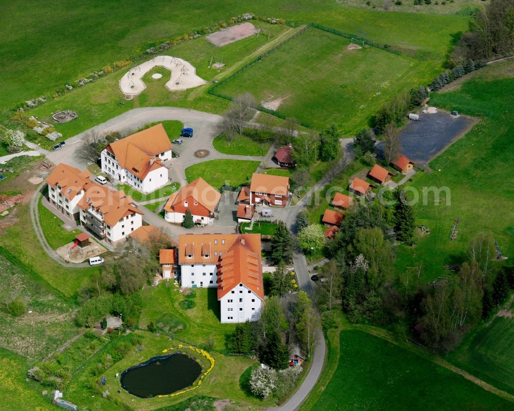 Aerial photograph Haunetal - Agricultural land and field boundaries surround the settlement area of the village in Haunetal in the state Hesse, Germany