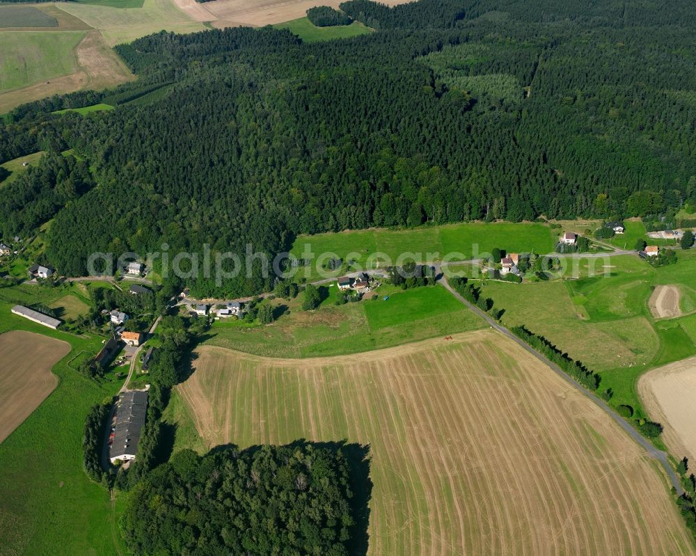 Hausdorf from the bird's eye view: Agricultural land and field boundaries surround the settlement area of the village in Hausdorf in the state Saxony, Germany