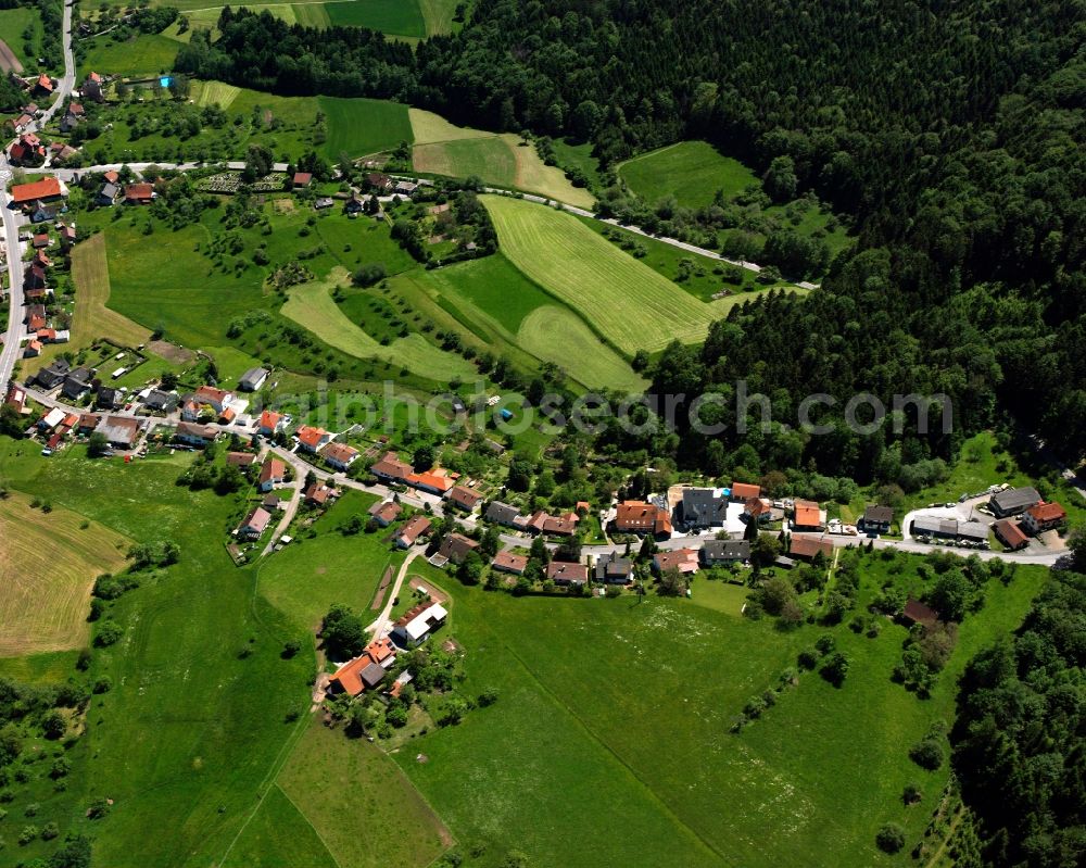 Hausen from above - Agricultural land and field boundaries surround the settlement area of the village in Hausen in the state Baden-Wuerttemberg, Germany