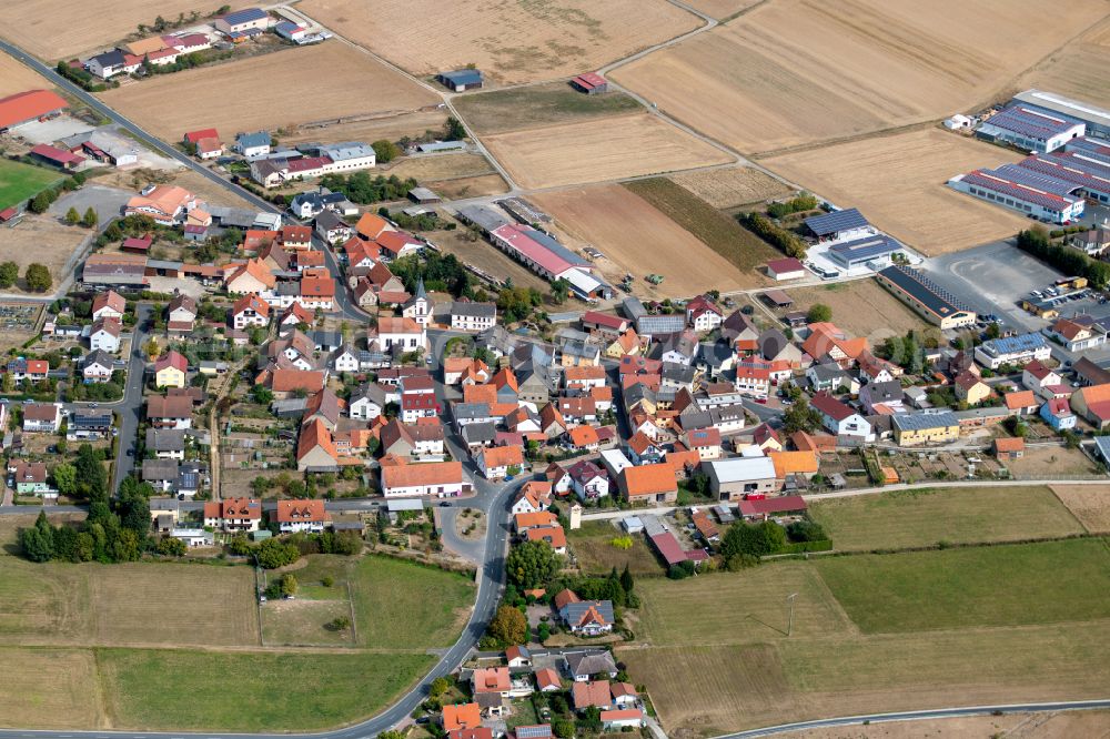 Hausen from the bird's eye view: Agricultural land and field boundaries surround the settlement area of the village in Hausen in the state Bavaria, Germany