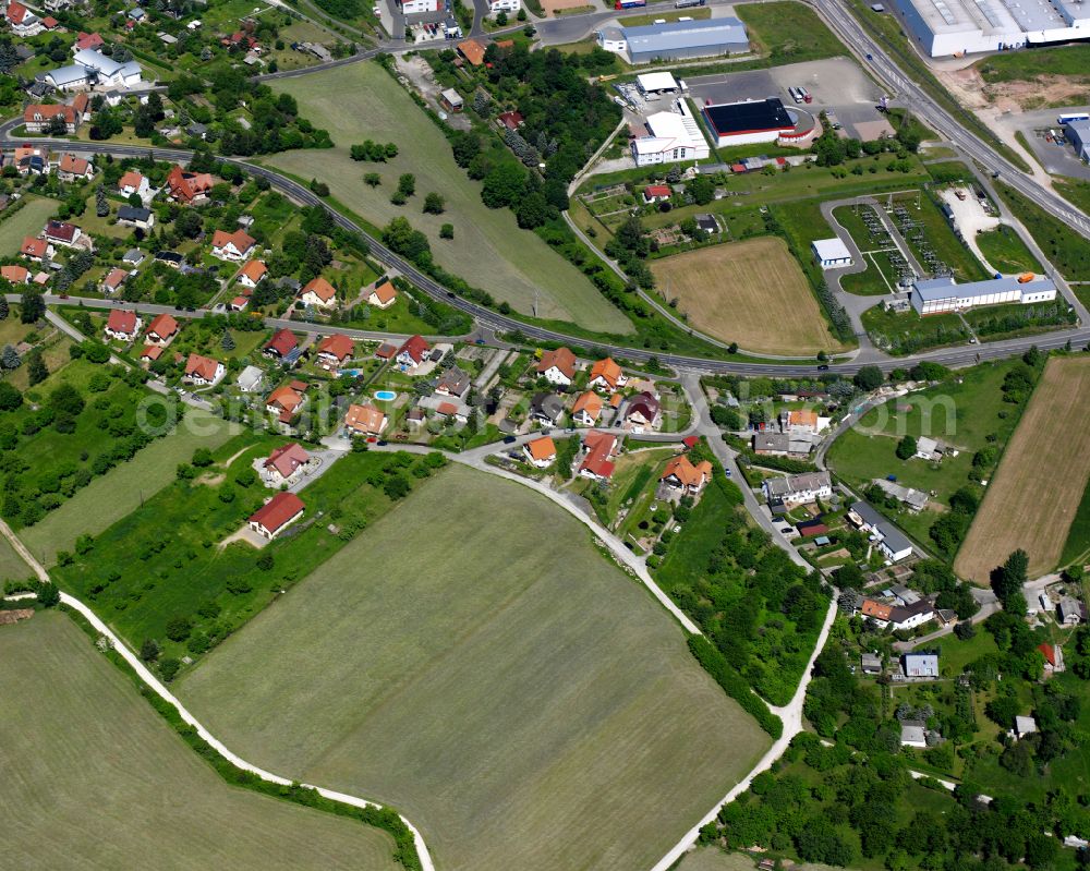 Aerial photograph Heilbad Heiligenstadt - Agricultural land and field boundaries surround the settlement area of the village in Heilbad Heiligenstadt in the state Thuringia, Germany