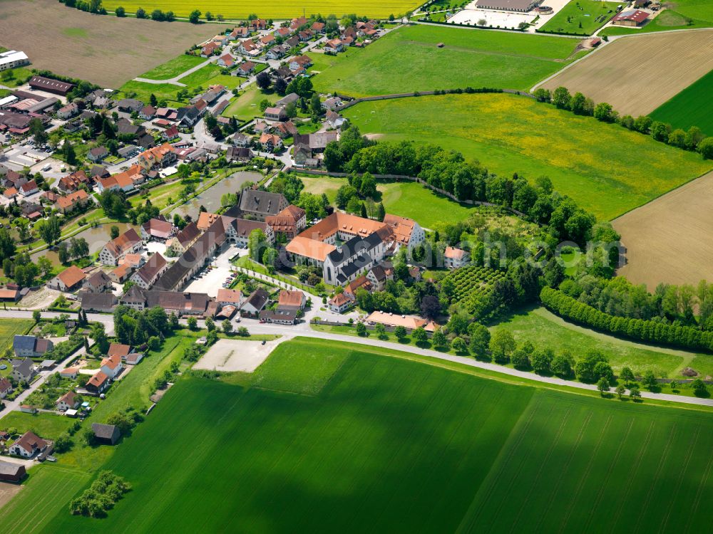 Heiligkreuztal from above - Agricultural land and field boundaries surround the settlement area of the village in Heiligkreuztal in the state Baden-Wuerttemberg, Germany