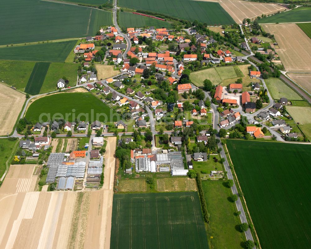 Heißum from above - Agricultural land and field boundaries surround the settlement area of the village in Heißum in the state Lower Saxony, Germany